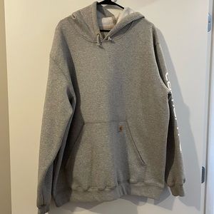 Light grey Carhartt hoodie with Carhartt on the left sleeve
